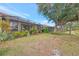 Community backyard with lush landscaping and lake view at 1375 Maseno Dr, Venice, FL 34292
