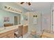 Large bathroom with double vanity and walk-in shower at 1375 Maseno Dr, Venice, FL 34292