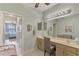 Double vanity bathroom with view of bedroom at 1375 Maseno Dr, Venice, FL 34292