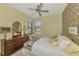 Bedroom with wood furniture and patterned wallpaper at 1375 Maseno Dr, Venice, FL 34292