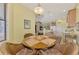Charming breakfast nook with wooden table and wicker chairs at 1375 Maseno Dr, Venice, FL 34292