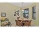 Cozy breakfast nook with a table and four chairs, overlooking a pond at 1375 Maseno Dr, Venice, FL 34292