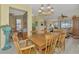 Spacious dining room with a large table and view into the living area at 1375 Maseno Dr, Venice, FL 34292