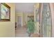 Bright entryway with hardwood floors and art at 1375 Maseno Dr, Venice, FL 34292