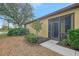 Back exterior view with screened-in patio and lush landscaping at 1375 Maseno Dr, Venice, FL 34292