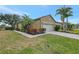 One-story home with light-colored exterior and palm trees at 1375 Maseno Dr, Venice, FL 34292