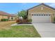 Villa with attached garage and manicured lawn at 1375 Maseno Dr, Venice, FL 34292