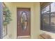 Elegant front door with oval glass and sidelights at 1375 Maseno Dr, Venice, FL 34292