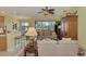 Bright living room features comfortable seating, large windows, and a view of the golf course at 1375 Maseno Dr, Venice, FL 34292