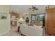 Open living room and kitchen with neutral colors and access to a patio at 1375 Maseno Dr, Venice, FL 34292