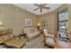 Home office with comfortable seating and large window at 1375 Maseno Dr, Venice, FL 34292