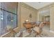 Home office with built-in desk and view of dining room at 1375 Maseno Dr, Venice, FL 34292