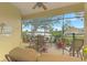 Spacious screened patio with lake view and seating area at 1375 Maseno Dr, Venice, FL 34292
