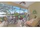 Relaxing screened patio overlooking a lake with seating area at 1375 Maseno Dr, Venice, FL 34292
