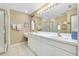 Main bathroom with double vanity and a large shower at 1602 Gondola Park Dr # 1602, Venice, FL 34292