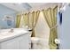 Clean bathroom with tub shower, vanity, and linen closet at 1602 Gondola Park Dr # 1602, Venice, FL 34292