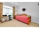 Bedroom with daybed, workspace, and floral curtains at 1602 Gondola Park Dr # 1602, Venice, FL 34292