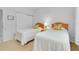 Two twin beds in a bright guest bedroom with double closets and wood flooring at 1602 Gondola Park Dr # 1602, Venice, FL 34292