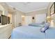Guest bedroom with twin beds, a dresser and access to the bathroom at 1602 Gondola Park Dr # 1602, Venice, FL 34292