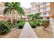 Community courtyard with lush landscaping and a fountain at 1602 Gondola Park Dr # 1602, Venice, FL 34292