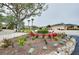 Landscaped entrance to the community with flowering plants at 1602 Gondola Park Dr # 1602, Venice, FL 34292
