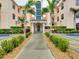 Inviting condo building entrance with lush landscaping and walkway at 1602 Gondola Park Dr # 1602, Venice, FL 34292