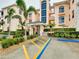 Building entrance with gated access and landscaping at 1602 Gondola Park Dr # 1602, Venice, FL 34292