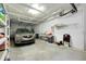 Attached garage with car, shelves, and additional storage at 1602 Gondola Park Dr # 1602, Venice, FL 34292