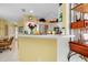 Kitchen features a breakfast bar and white cabinetry at 1602 Gondola Park Dr # 1602, Venice, FL 34292
