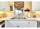 Kitchen features a double sink and window overlooking the outdoors at 1602 Gondola Park Dr # 1602, Venice, FL 34292