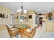 Kitchen and dining area with stainless steel appliances and breakfast bar at 1602 Gondola Park Dr # 1602, Venice, FL 34292
