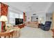 Living room with beige sofa and blue recliner, open floor plan at 1602 Gondola Park Dr # 1602, Venice, FL 34292