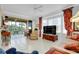 Living room with access to a screened balcony overlooking a patio at 1602 Gondola Park Dr # 1602, Venice, FL 34292
