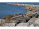 Rocky shoreline with ocean view and people fishing at 1602 Gondola Park Dr # 1602, Venice, FL 34292