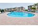 Inviting kidney-shaped pool with surrounding patio and lounge chairs at 1602 Gondola Park Dr # 1602, Venice, FL 34292