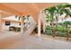 Well-lit stairwell leading to the courtyard at 1602 Gondola Park Dr # 1602, Venice, FL 34292