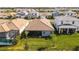 Community of homes, showcasing a variety of architectural styles and lush landscaping at 17953 Grand Prosperity Dr, Venice, FL 34293