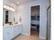 Double vanity bathroom with walk-in shower and large closet at 17953 Grand Prosperity Dr, Venice, FL 34293