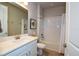 Clean bathroom with bathtub, shower, and white vanity at 17953 Grand Prosperity Dr, Venice, FL 34293