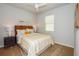 Charming bedroom with a full-size bed and unique headboard at 17953 Grand Prosperity Dr, Venice, FL 34293