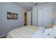 Cozy bedroom with a full-size bed and access to hallway at 17953 Grand Prosperity Dr, Venice, FL 34293