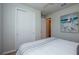Bright bedroom featuring a queen bed and large closet at 17953 Grand Prosperity Dr, Venice, FL 34293