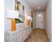 Bright entryway with wood-look tile floors and decorative console table at 17953 Grand Prosperity Dr, Venice, FL 34293