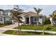 Single-story home with gray exterior, brown roof, and landscaping at 17953 Grand Prosperity Dr, Venice, FL 34293