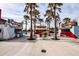 A vibrant food truck area with palms offering various culinary delights in a lively setting at 17953 Grand Prosperity Dr, Venice, FL 34293