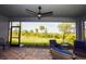 Screened lanai with patio furniture and backyard view at 17953 Grand Prosperity Dr, Venice, FL 34293