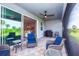 Covered lanai offers comfortable seating and a grill at 17953 Grand Prosperity Dr, Venice, FL 34293