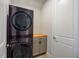 Laundry room with stacked LG washer and dryer at 17953 Grand Prosperity Dr, Venice, FL 34293