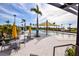 Relaxing resort-style pool with shaded seating and palm trees at 17953 Grand Prosperity Dr, Venice, FL 34293