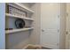 Built-in shelving with decorative items and welcome sign at 17953 Grand Prosperity Dr, Venice, FL 34293